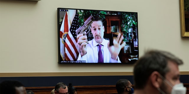 Rep. Greg Steube, R-Fla., demonstrates assembling his handgun as he speaks remotely during a House Judiciary Committee mark up hearing in the Rayburn House Office Building on June 2, 2022 in Washington.