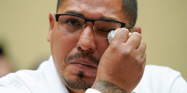 Miguel Cerrillo, father of Miah Cerrillo a fourth grade student at Robb Elementary School in Uvalde, Texas, wipes his eye as he testifies during a House Committee on Oversight and Reform hearing on Capitol Hill in Washington, Wednesday, June 8, 2022.