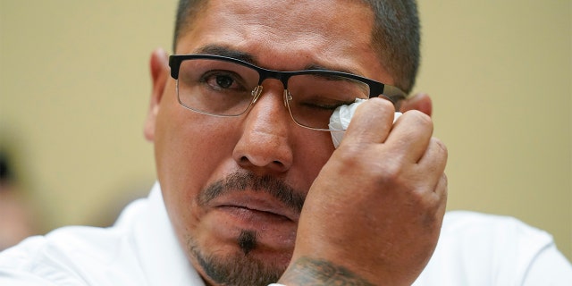 Miguel Cerrillo, father of Miah Cerrillo a fourth grade student at Robb Elementary School in Uvalde, Texas, wipes his eye as he testifies during a House Committee on Oversight and Reform hearing on gun violence on Capitol Hill in Washington, Wednesday, June 8, 2022. (AP Photo/Andrew Harnik, Pool)