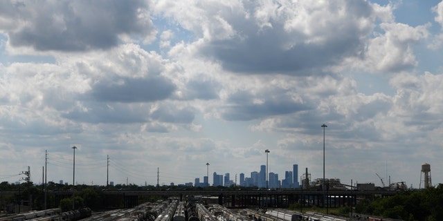 The Houston skyline is seen beyond a railroad yard by the Houston Ship Channel in Houston, Texas, US, May 5, 2019. 