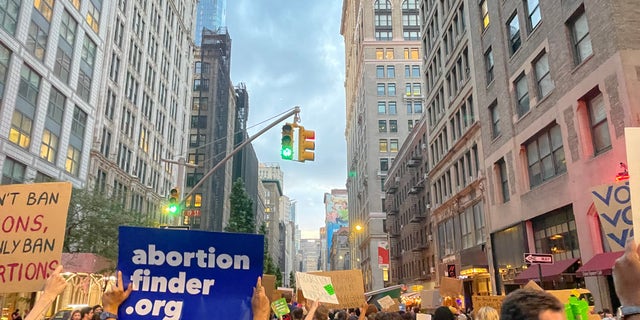 Protestors are seen marching in the streets of New York City in response to the Supreme Court's ruling on Roe v. Wade.