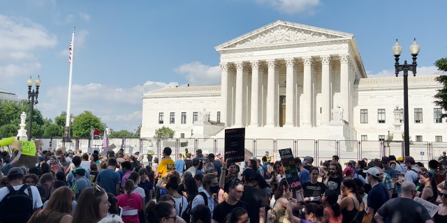 Demonstrators gather outside the Supreme Court in Washington, D.C., on June 24, 2022, the day the high court issued its monumental ruling on abortion.