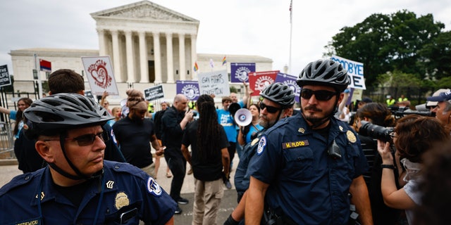 WASHINGTON D.C. - JUNE 21: Demonstrators outside the Supreme Court Tuesday morning ahead of possible announcement on Dobbs v. Jackson