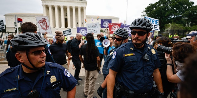 WASHINGTON D.C. - JUNE 21: Demonstrators outside the Supreme Court Tuesday morning ahead of possible announcement on Dobbs v. Jackson