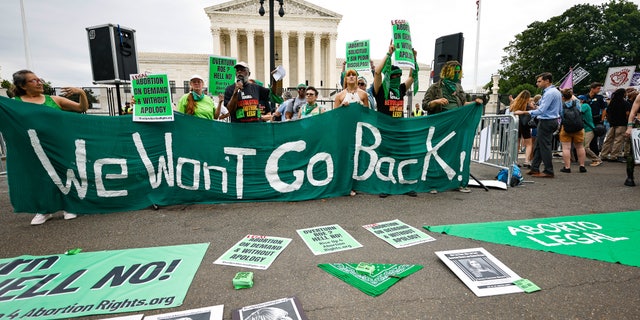 Demonstrators outside the Supreme Court Tuesday morning ahead of possible announcement on Dobbs v. Jackson