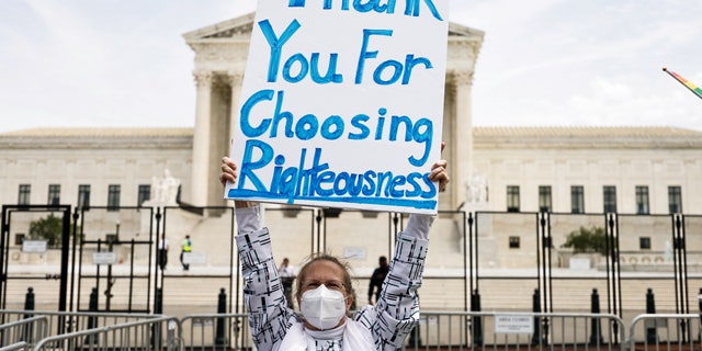 WASHINGTON D.C. - JUNE 21: Demonstrators outside the Supreme Court Tuesday ahead of possible announcement on Dobbs v. Jackson