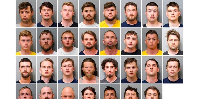 These booking images provided by the Kootenai County Sheriff’s Office show the 31 members of the white supremacist group Patriot Front who were arrested after they were found packed into the back of a U-Haul truck with riot gear near an LGBTQ pride event in Coeur d’Alene, Idaho, on Saturday, June 11, 2022. Top row, from left, are Jared Boyce, Nathan Brenner, Colton Brown, Josiah Buster, Mishael Buster, Devin Center, Dylan Corio, and Winston Durham. Second row, from left, are Garret Garland, Branden Haney, Richard Jessop, James Julius Johnson, James Michael Johnson, Connor Moran, Kieran Morris and Lawrence Norman. Third row, from left, are Justin O'leary, Cameron Pruitt, Forrest Rankin, Thomas Rousseau, Conor Ryan, Spencer Simpson, Alexander Sisenstein and Derek Smith. Bottom row, from left, are Dakota Tabler, Steven Tucker, Wesley Van Horn, Mitchell Wagner, Nathaniel Whitfield, Graham Whitsom and Robert Whitted. 