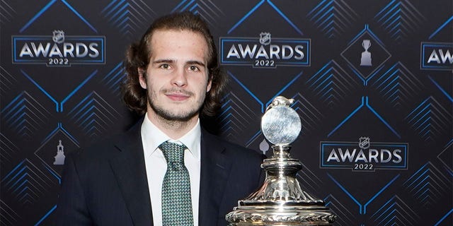 New York Rangers goalie Igor Shesterkin poses with the. Vezina Trophy after the NHL hockey awards Tuesday, June 21, 2022, in Tampa, Fla. The Vezina Trophy is presented annually to the leagues' best goalie. 