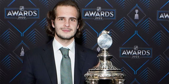 Posing with New York Rangers goalkeeper Igor Shesterkin.  The Vezina Trophy after the NHL Hockey Awards on Tuesday, June 21, 2022 in Tampa, Fla.  The Vezina Trophy is awarded every year to the best goalkeeper in the league. 