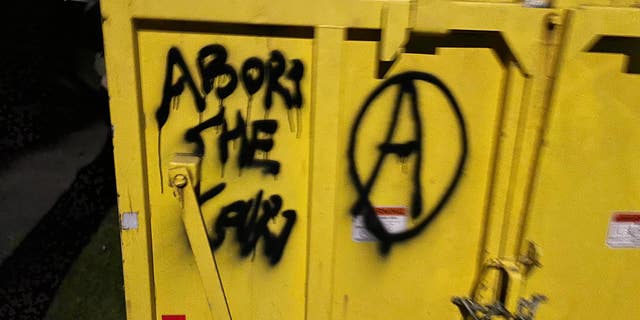 Rioters march the streets of downtown Portland, smashing windows and graffitiing local businesses on June 25, 2022. (Fox News/Bradford Betz)