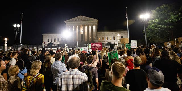 Protesters gather outside of the Supreme Court building after the historic ruling to overturn Roe vs. Wade. 