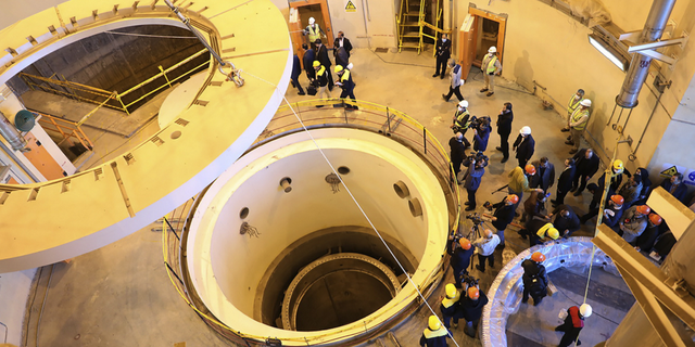 In this photo released by the Atomic Energy Organization of Iran, technicians work at the Arak heavy water reactor's secondary circuit, as officials and media visit the site, near Arak, 150 miles southwest of the capital of Tehran, in December 2019. (Associated Press)
