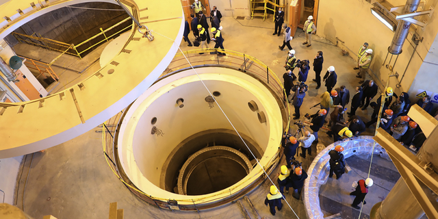 Technicians work at the heavy-water reactor near Arak, Iran, in December 2019.