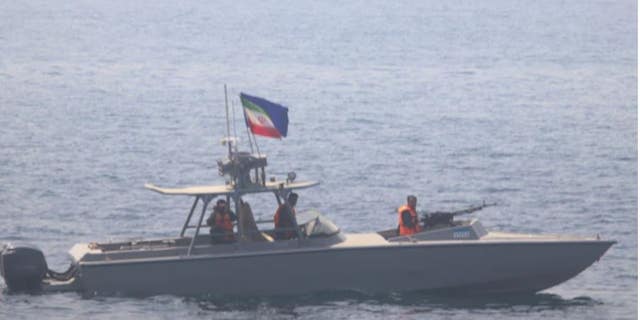 An Iranian naval vessel challenges the USS Sirocco.