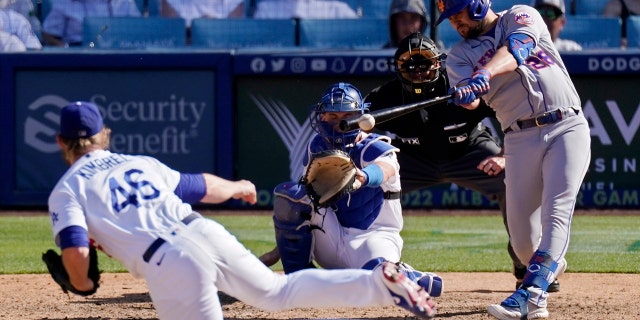 New York Mets' J.D. Davis hits an RBI double against the Dodgers Sunday, June 5, 2022, in Los Angeles.