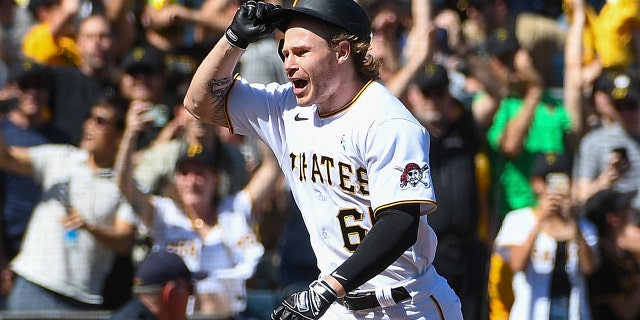 Jack Suwinski #65 of the Pittsburgh Pirates reacts as he rounds the bases after hitting a walk off solo home run to give the Pirates a 4-3 win over the San Francisco Giants during the game at PNC Park on June 19, 2022 in Pittsburgh, Pennsylvania.