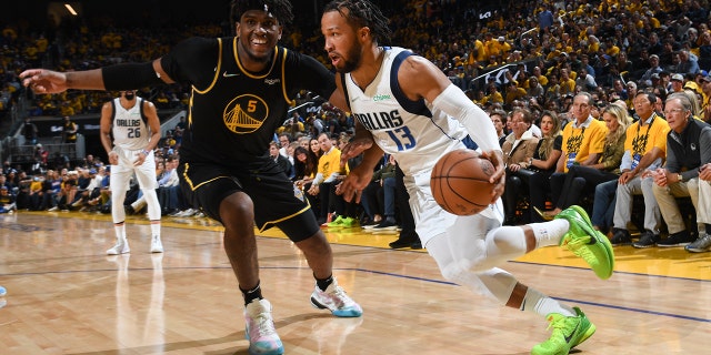 Jalen Brunson of the Dallas Mavericks drives to the basket against the Golden State Warriors during Game 5 of the 2022 NBA Western Conference finals May 26, 2022, at Chase Center in San Francisco.