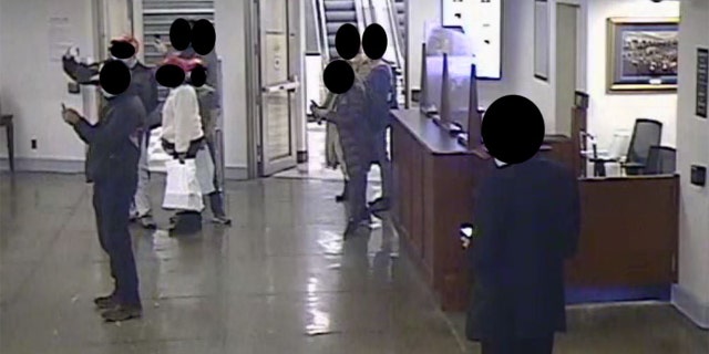 The House Committee on January 6 released images from surveillance video of a tour of the US Capitol led by Republican Representative Barry Loudermilk, January 5, 2021.