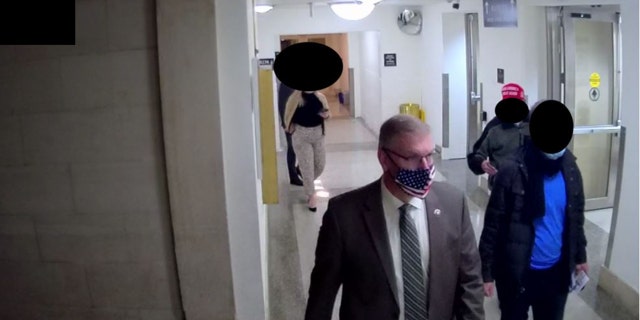 The House Committee on January 6 released images from surveillance video of a tour of the US Capitol led by Republican Representative Barry Loudermilk, January 5, 2021.