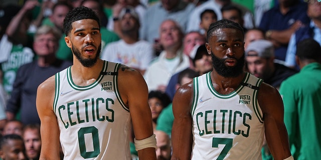 Boston Celtics' Jayson Tatum #0 and Jaylen Brown #7 walk off the field against the Golden State Warriors in Game 4 of the 2022 NBA Finals on June 10, 2022 at TD Garden in Boston, Massachusetts.