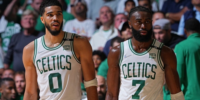 Jayson Tatum #0 and Jaylen Brown #7 of the Boston Celtics walk off the court against the Golden State Warriors during Game Four of the 2022 NBA Finals on June 10, 2022 at TD Garden in Boston, Massachusetts.