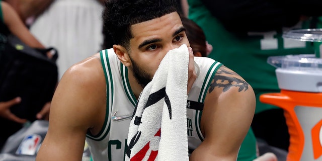 Celtics' Jayson Tatum is pictured on the bench as the final seconds of the NBA Finals tick off of the clock at the TD Garden in Boston on June 17, 2022.