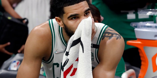 Celtics' Jayson Tatum is pictured on the bench as the final seconds of the NBA Finals tick off of the clock at the TD Garden in Boston on June 17, 2022.