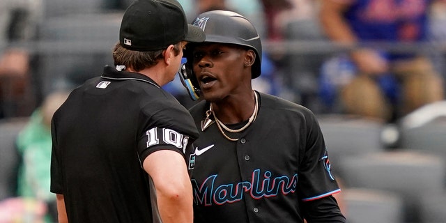 Umpire Adam Beck throws Miami Marlins' Jazz Chisholm Jr., right, out of the game after arguing balls and strikes in the ninth inning of a baseball game against the New York Mets, Saturday, June 18, 2022, in New York. 