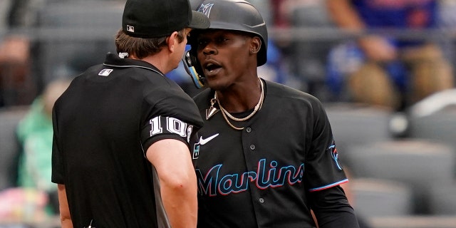 Umpire Adam Beck throws Miami Marlins' Jazz Chisholm Jr., right, out of the game after arguing balls and strikes in the ninth inning of a baseball game against the New York Mets, Saturday, June 18, 2022, in New York. 