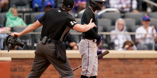 Umpire Adam Beck throws Miami Marlins' Jazz Chisholm Jr., right, out of the game after arguing balls and strikes in the ninth inning of a baseball game against the New York Mets, Saturday, June 18, 2022, in New York. 