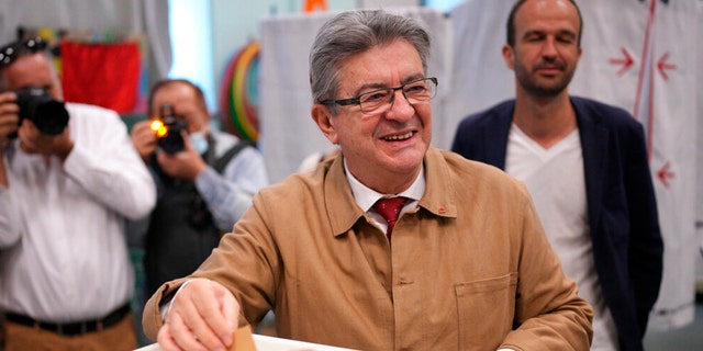 Hard-left figure Jean-Luc Melenchon casts his ballot in the first round of the parliamentary election, Sunday, June 12, 2022, in Marseille, southern France.