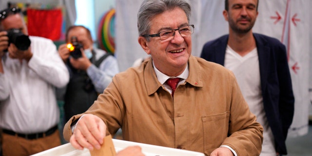 Hard-left figure Jean-Luc Melenchon casts his ballot in the first round of the parliamentary election, Sunday, June 12, 2022, in Marseille, southern France.