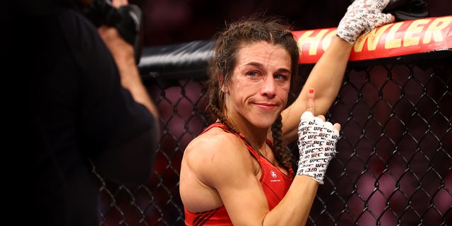 Joanna Jedrzejczyk of Poland reacts after her strawweight bout against Zhang Weili of China during UFC 275 at Singapore Indoor Stadium on June 12, 2022, in Singapore. Zhang Weili of China won via a second round knockout.