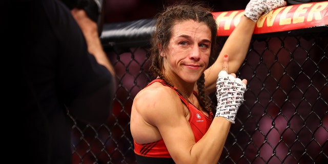 Joanna Jedrzejczyk of Poland reacts after her strawweight bout against Zhang Weili of China during UFC 275 at Singapore Indoor Stadium on June 12, 2022, in Singapore. Zhang Weili of China won via a second round knockout.