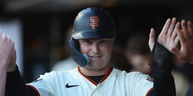 Joc Pederson of the San Francisco Giants celebrates after scoring against the Los Angeles Dodgers at Oracle Park June 11, 2022, in San Francisco.