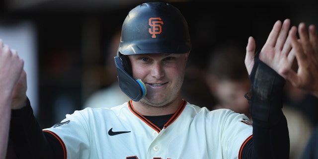 Joc Pederson of the San Francisco Giants celebrates after scoring against the Los Angeles Dodgers at Oracle Park June 11, 2022, in San Francisco.