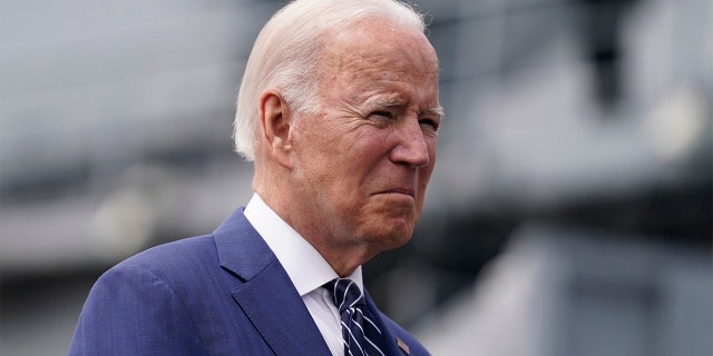 President Biden waits before giving remarks on inflation and supply chain issues at the Port of Los Angeles, Friday, June 10, 2022, in Los Angeles.