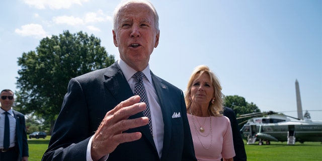 First lady Jill Biden listens as President Biden talks to reporters before boarding Marine One on the South Lawn of the White House, Friday, June 17, 2022, in Washington. (AP Photo/Evan Vucci)