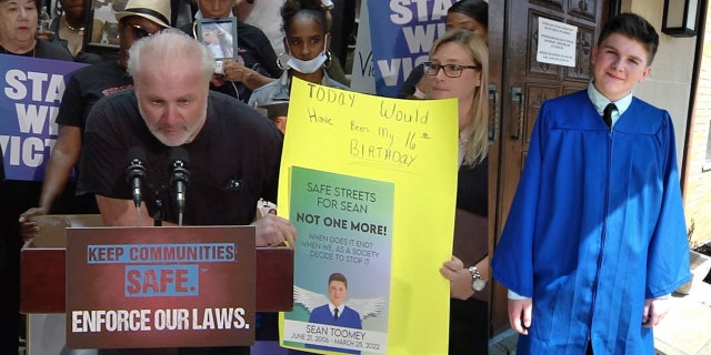 A photo combination of John Toomey speaking out at a press conference about his son's murder. On the right is a photo of 15-year-old Seen Toomey.