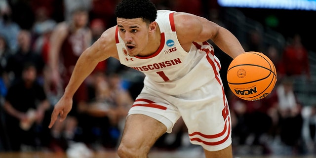 Johnny Davis of Wisconsin dribbles during a first round game of the NCAA College Basketball Tournament against Colgate on March 18, 2022 in Milwaukee.
