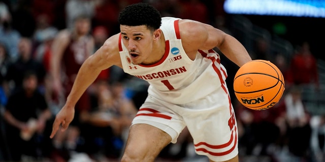 Johnny Davis of Wisconsin dribbles during a first round game of the NCAA College Basketball Tournament against Colgate on March 18, 2022 in Milwaukee.