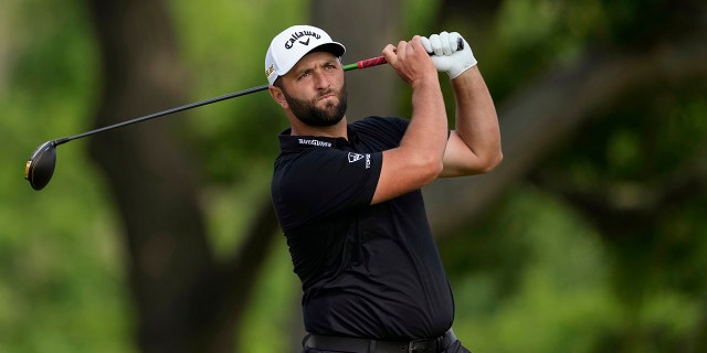 Jon Rahm, of Spain, watches his shot on the fourth hole during the first round of the U.S. Open golf tournament at The Country Club, Thursday, June 16, 2022, in Brookline, Mass.