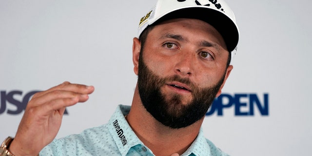 Jon Rahm, of Spain, answers a reporter's question during a media availability ahead of the U.S. Open golf tournament, Tuesday, June 14, 2022, at The Country Club in Brookline, Mass.