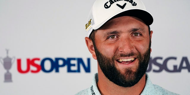 Jon Rahm, of Spain, answers a reporter's question during a media availability ahead of the U.S. Open golf tournament, Tuesday, June 14, 2022, at The Country Club in Brookline, Mass. 