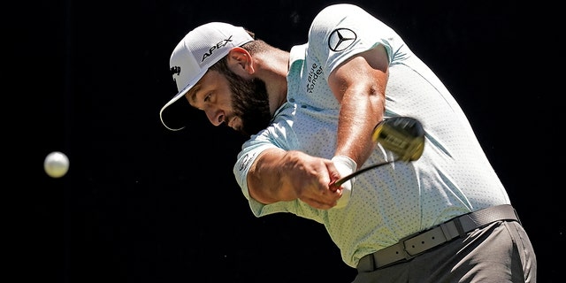 Jon Rahm, from Spain, shoots on the fifth tee during a practice round ahead of the U.S. Open golf tournament, Tuesday, June 14, 2022, at The Country Club in Brookline, Mass.