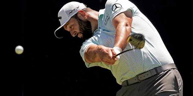 Jon Rahm, from Spain, shoots on the fifth tee during a practice round ahead of the U.S. Open golf tournament, Tuesday, June 14, 2022, at The Country Club in Brookline, Mass.