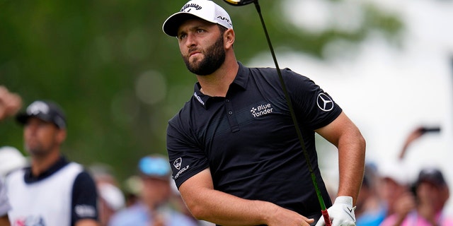 Jon Rahm of Spain watches his swing on the 15th hole during the first round of the US Open golf tournament at the Country Club, Thursday, June 16, 2022, in Brookline, Massachusetts.