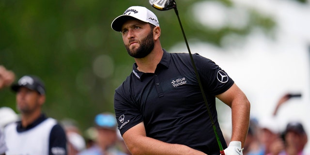 Jon Rahm, of Spain, watches his shot on the 15th hole during the first round of the U.S. Open golf tournament at The Country Club, Thursday, June 16, 2022, in Brookline, Mass.