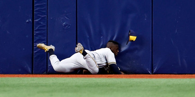 Jonathan Davis #3 of the Milwaukee Brewers makes makes a diving catch off a fly ball from the bat of Randy Arozarena #56 of the Tampa Bay Rays during the second inning at Tropicana Field on June 29, 2022 in St Petersburg, Florida.