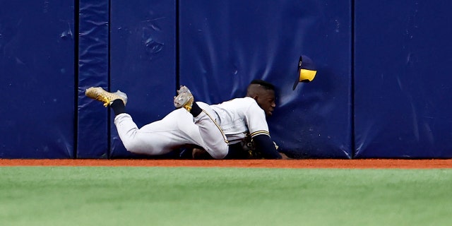 Jonathan Davis #3 of the Milwaukee Brewers makes makes a diving catch off a fly ball from the bat of Randy Arozarena #56 of the Tampa Bay Rays during the second inning at Tropicana Field on June 29, 2022 in St Petersburg, Florida.